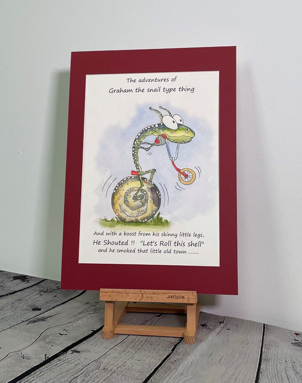 Graham the Snail pedalling his bicycle around town. Dean Reeve Art Prints and originals from the fictional narrative world of Quasiland